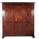 An Adams style mahogany triple door wardrobe, the