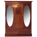 An Edwardian mahogany double mirror door wardrobe,