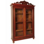 A 19th century Empire style bookcase, having two g