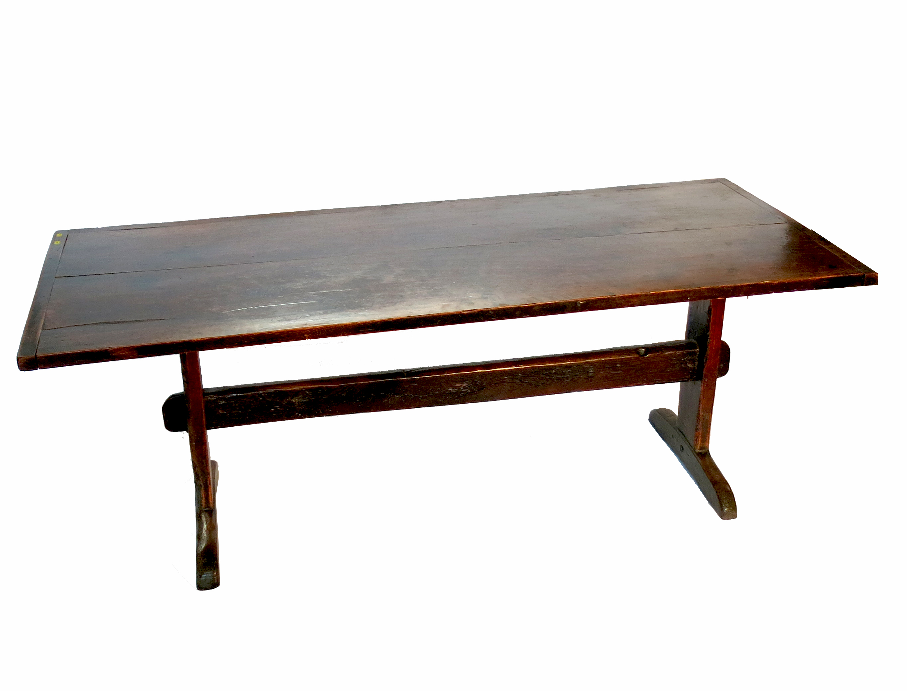 An 18th century style oak refectory table, having a cleated plank top raised on solid ends, with