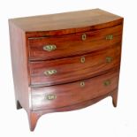 A mahogany bow front chest, of three long drawers