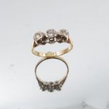 A three stone illusion set 18 carat gold ring, 2.9g gross