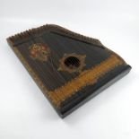 A 19th century Anglo American international guitar-zither, made in Saxony, having 49 chromatic