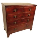 A late Georgian oak chest, of two short drawers ov