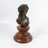 A bronze bust, of a classical female, on a wooden socle base, height of bust 6.75ins, overall height
