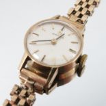 Omega, a lady's 9 carat gold mechanical wrist watch, the signed white dial with black gilt batons