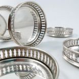 A set of six silver coaster, of circular form with pierced gallery sides, marked 800, weight 5oz,