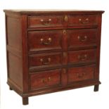 A 17th century oak chest, of four long drawers wit