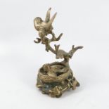 A Victorian brass model, of a bird on a branch feeding a chick in its nest, height 7.5ins