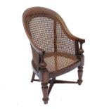 A 19th century mahogany child's high chair, with cane back and seat, missing base