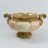 A Royal Worcester blush ivory bowl, with gilt rim