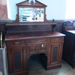 An Edwardian mahogany mirror back sideboard, the base fitted with three frieze drawers over a