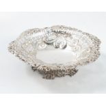 A silver pedestal dish, of shaped circular form, with pierced and embossed decoration, London