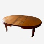 A 19th century oak oval extending dining table, ra