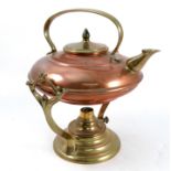 A W.A.S Benson copper and brass spirit kettle on stand, the flattened circular copper kettle with