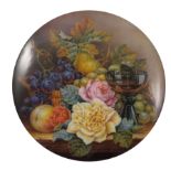 A porcelain plaque, finely painted with a still li