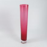 A cranberry glass vase, of cylindrical form, stamped Heal’s to the base, height 14.5ins