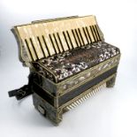 A Ranco Antonio piano accordion, the grey marbled case with scroll and jewelled decoration