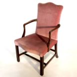 A Chippendale style mahogany hump back open armchair, on square legs united by stretchers