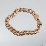 A bracelet, of solid curb links, stamped '585' over '14k', 21.5cm long, 36.6g gross