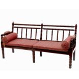 A 19th century oak bobbin turned settee, with solid seat and cushion, width 71ins, seat depth 21.