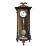 A 19th century wall clock, with circular dial and