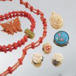 A quantity of jewellery, to include two coral necklaces, a silver hinged bangle and other items