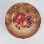 An English bone china cabinet plate, decorated with fruit to a mossy background by N Creed, diameter