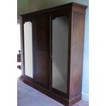 An Edwardian mahogany wardrobe, fitted with two mi