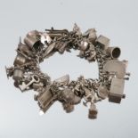 A silver charm bracelet, together with loose charms and rings
