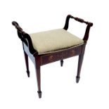 An Edwardian mahogany piano stool, having a pair of turned handles, hinged seat, satinwood inlay and
