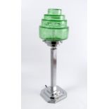 An Art Deco table lamp, the stepped circular green cracked ice shade supported on a chrome