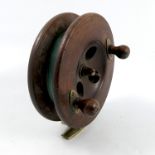 An Antique mahogany and brass fishing reel, diameter 6ins