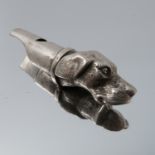 A white metal dog's head whistle, unmarked, af