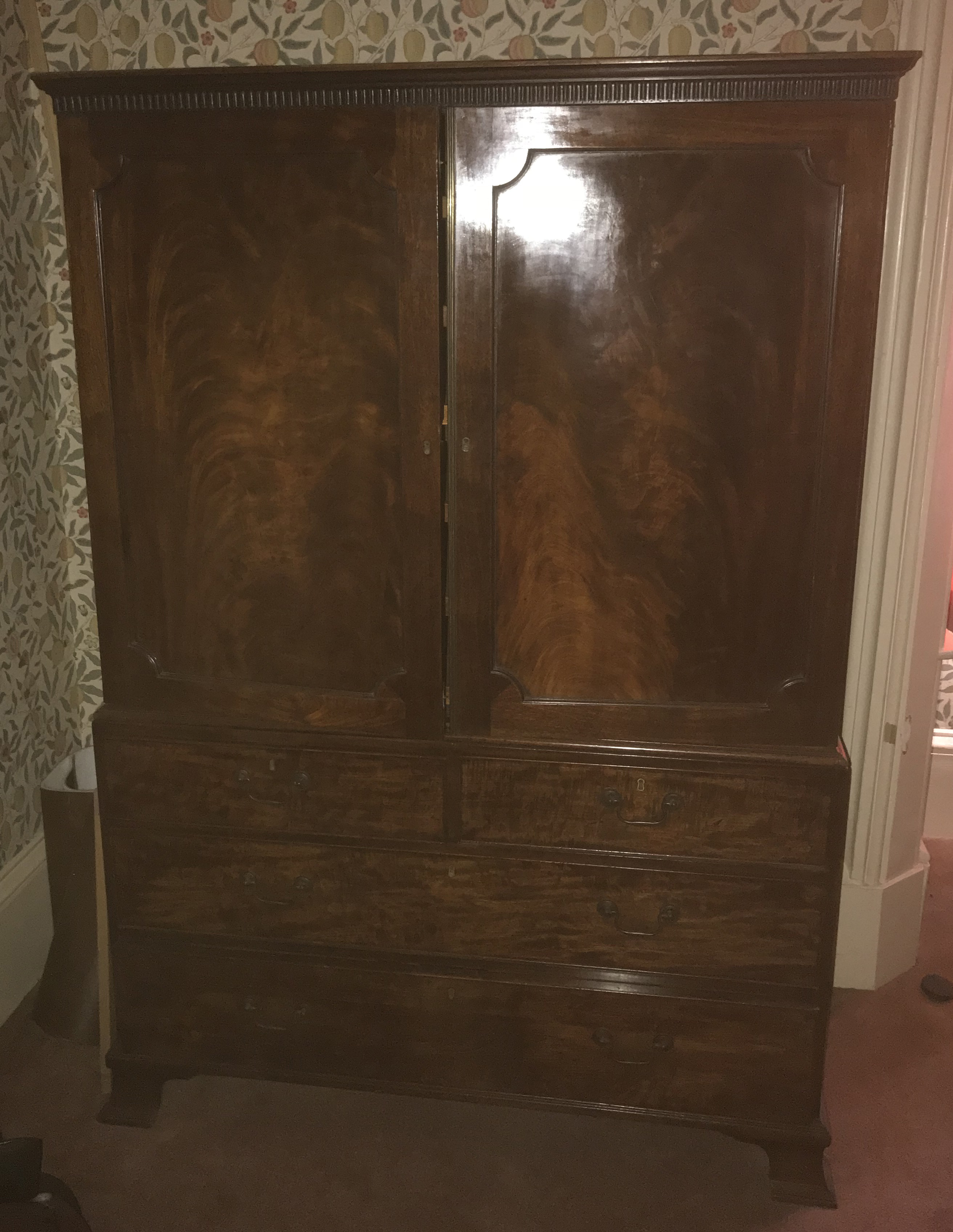 A 19th century mahogany linen press, having two pa