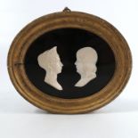 A pair of framed French Empire carved ivory portra