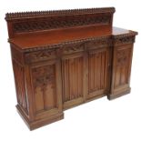 An oak Gothic design breakfront sideboard, with ca