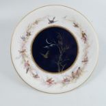 A Royal Worcester plate, decorated all around with