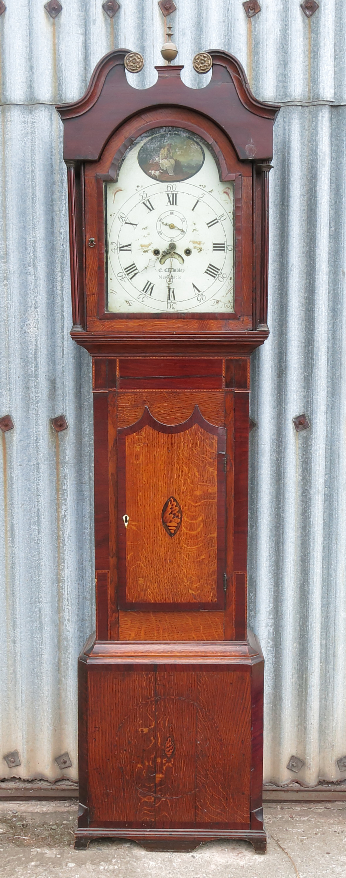 A 19th century north country oak long case clock, having painted dial with figure and dog within a