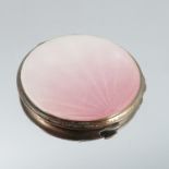 A silver and enamel powder compact, Birmingham 1939, of circular outline, fading pink guilloche