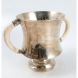 A silver two handled vessel, of waisted form, rais