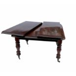 A Victorian mahogany extending dining table, raise