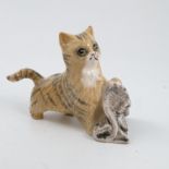 A Royal Doulton model, of a cat playing with a new
