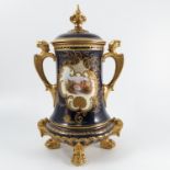 A Coalport covered vase, the scroll framed cartouc