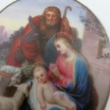An oval painting on porcelain, a religious group o