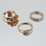A three stone ring, 9 carat gold, together with an eternity ring stamped '9ct', 6.6g gross, and a