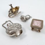 A collection of novelty silver items, to include a stamp box, with stamp to the lid, curved body