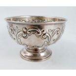 A silver pedestal bowl, embossed with scrolls, raised on a pedestal foot, London 1901, weight 4oz