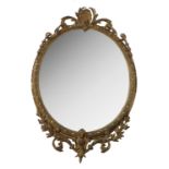 A 19th century oval mirror, the frame decorated wi