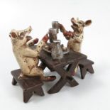 A Bergman cold painted bronze model, of two pigs seated at a table with pint glasses in their